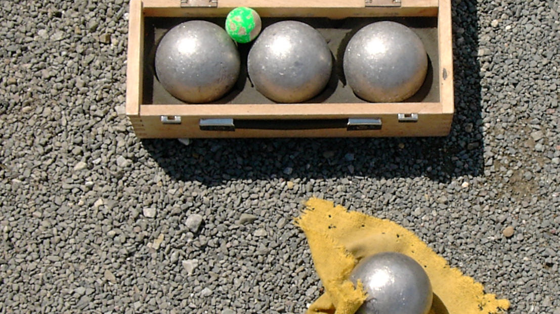 A complete bocce set with balls and pallino, the equipment needed to play a frame