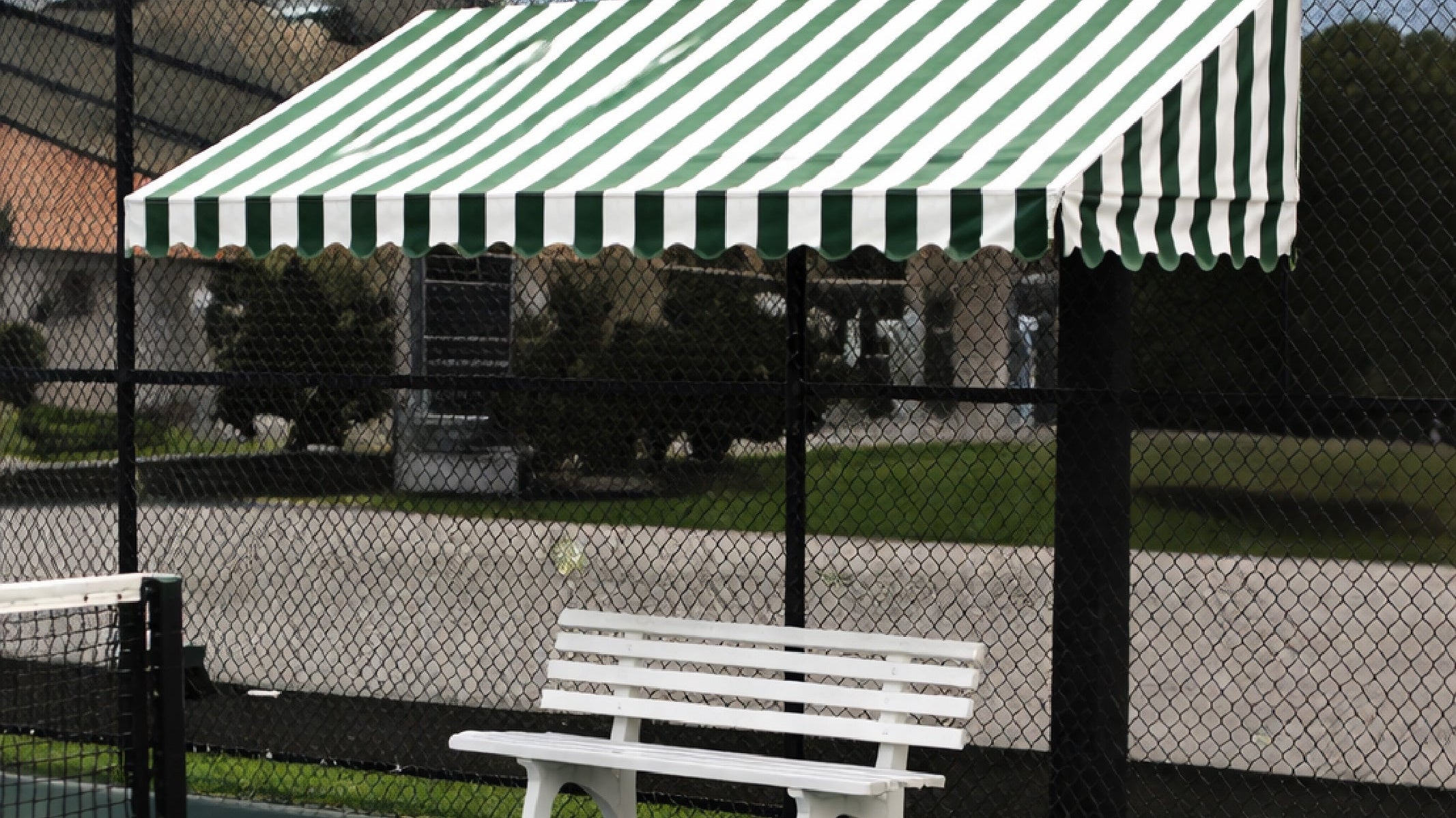 Bocce rules for ball boundaries with green-white fence canopy