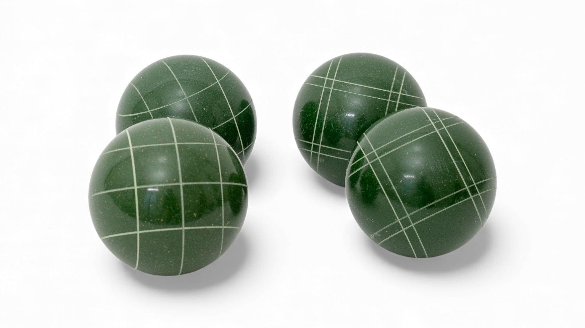 110 mm dark green bocce balls, the grass-friendly size for backyard lawn play