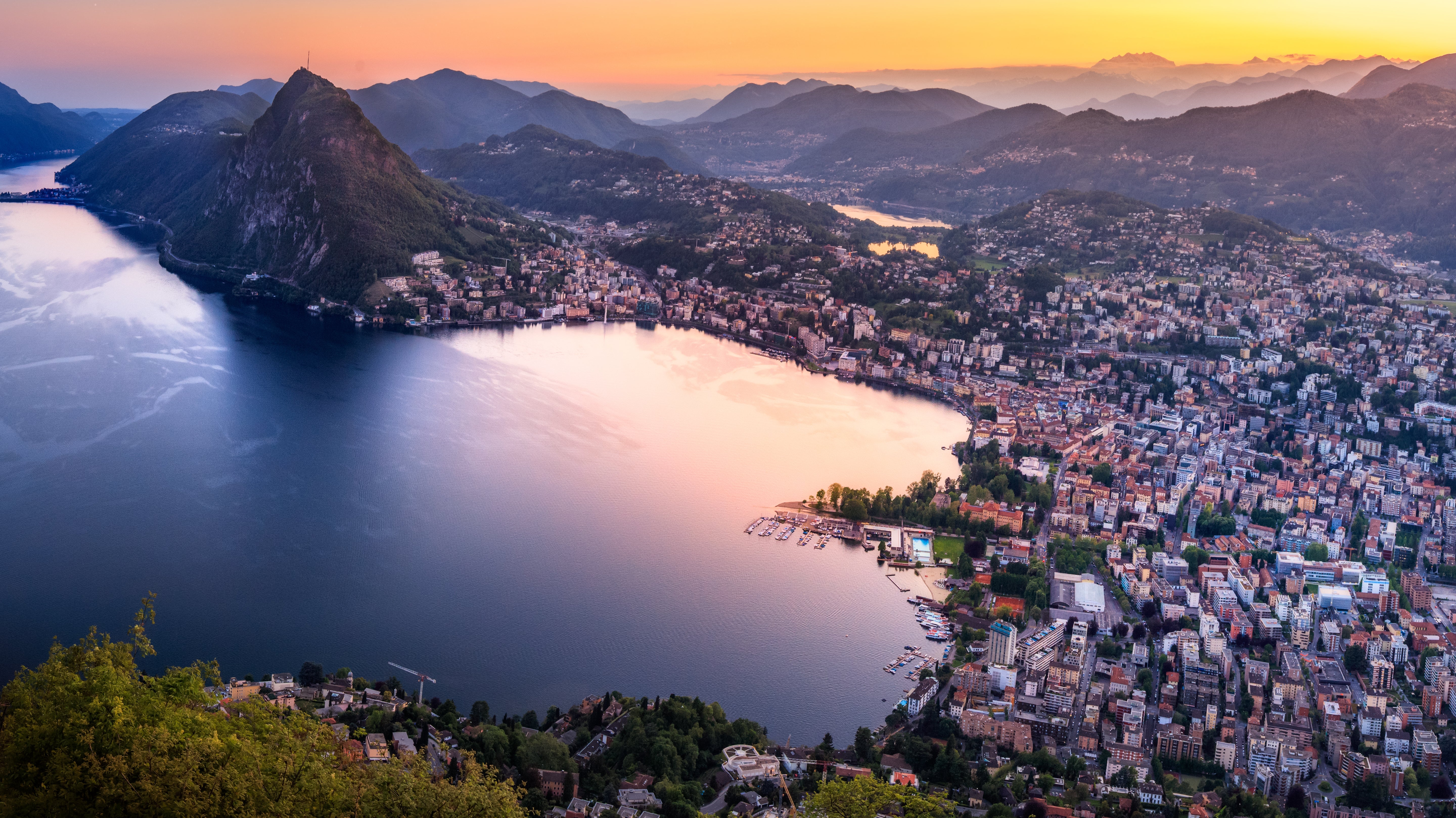 Lago di Lugano at sunset in the Italian-speaking canton of Ticino, Switzerland