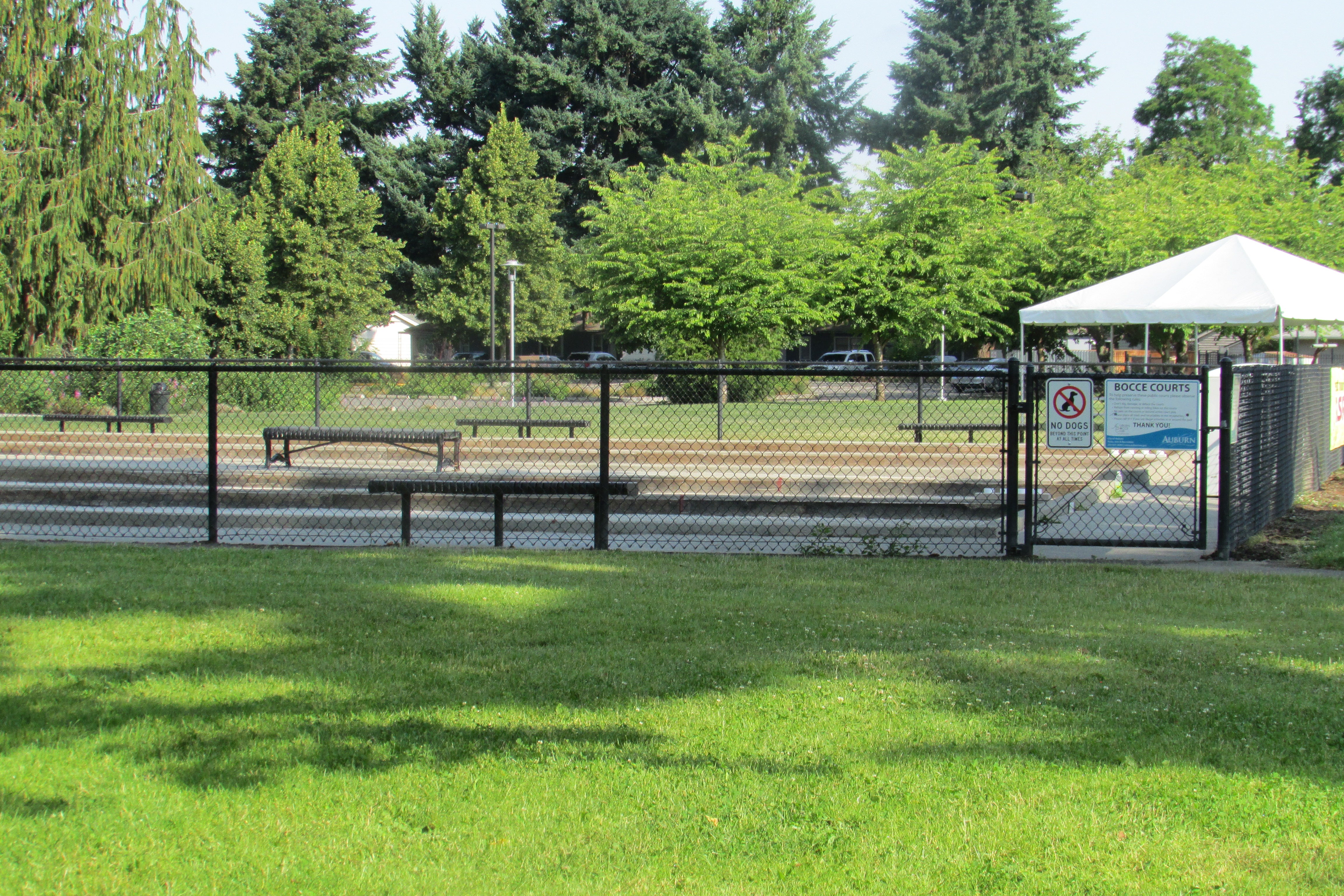 Outdoor bocce court showing oyster shell surface and wood side rails for regulation play