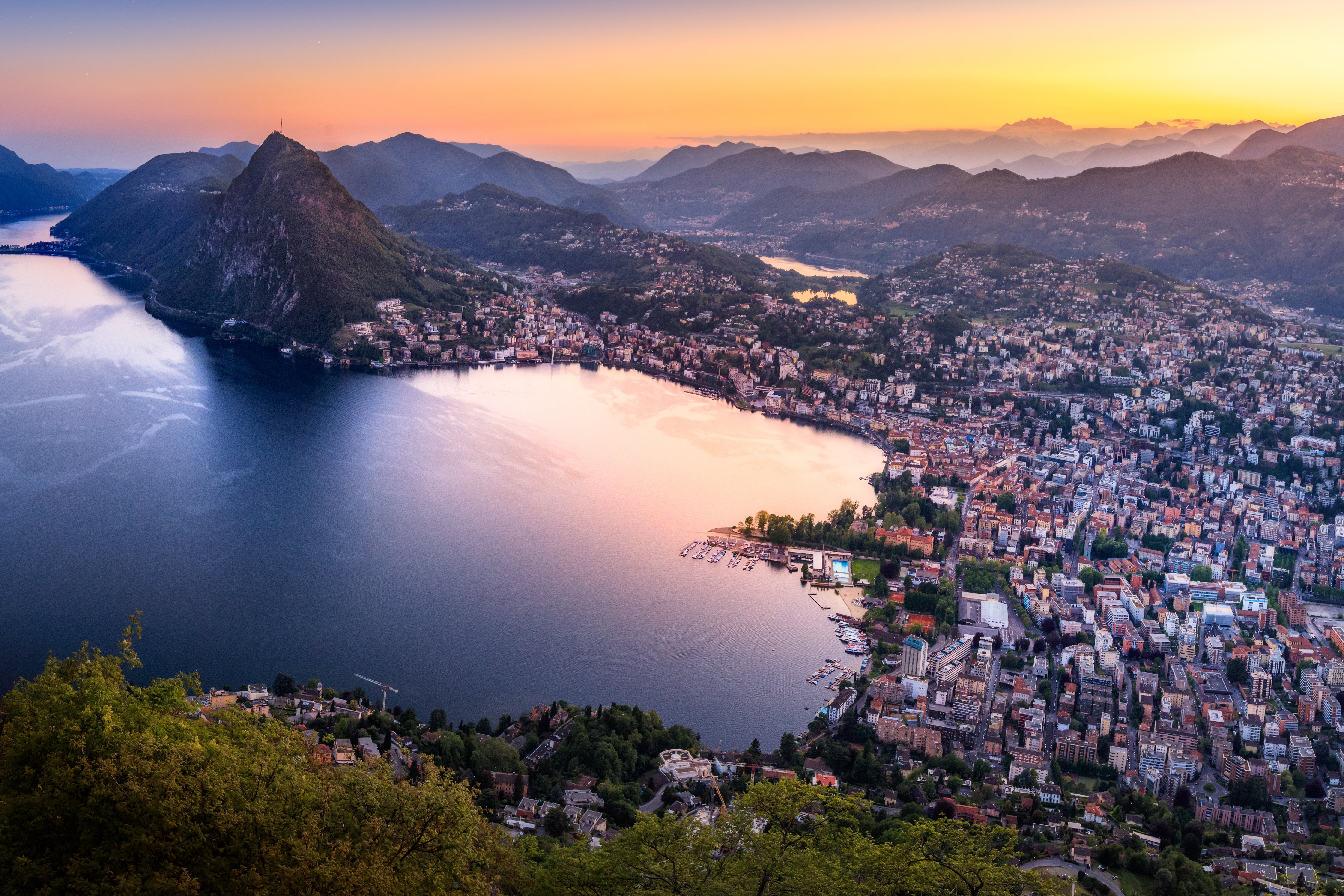 Lago di Lugano at sunset in the Italian-speaking canton of Ticino, Switzerland